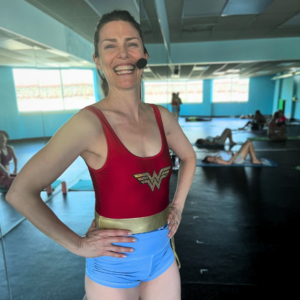 Owner Jen strikes a yoga pose in fun outfit